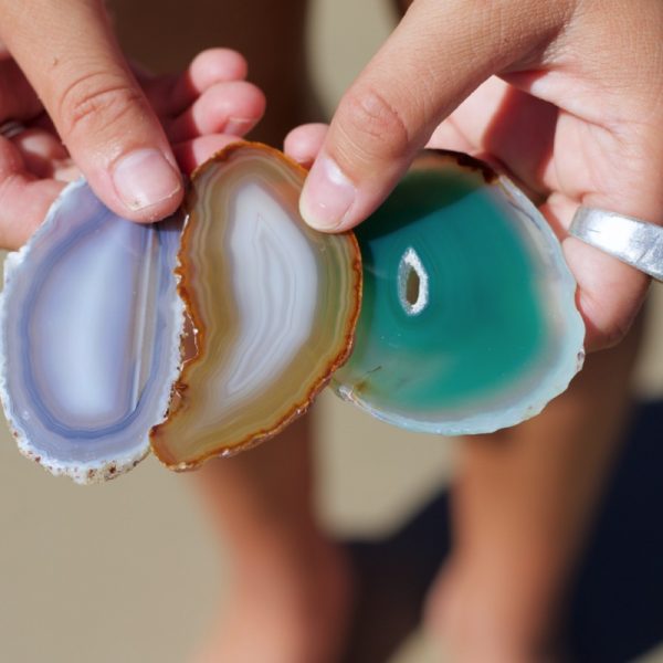 An Agate Crystal slice is embedded into one face of the Pyramid Candle.