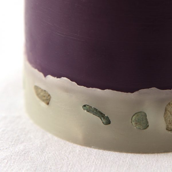 Each base of the large and medium pillar is embedded with pebble. Once the candle has burnt down to this point, the flame will flicker amongst the stone for many hours. Photo Luke Brown